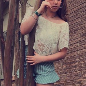 High-waisted green and white Lydelle shorts.